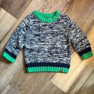 Black and White Knit Sweater with Green Accents